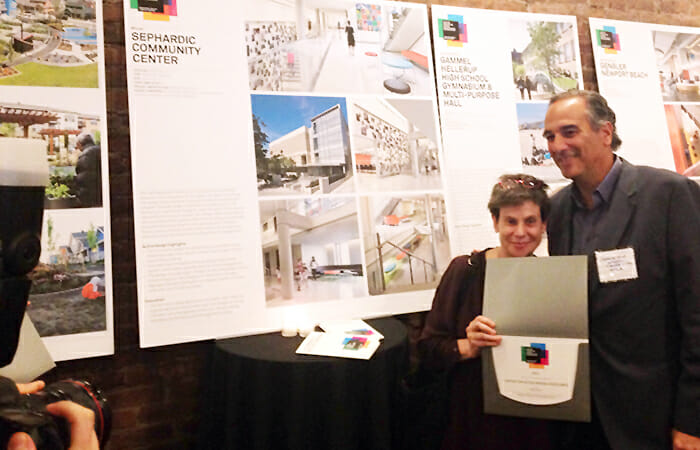 Joan Krevlin and Charles Azar, of the Sephardic Community Center, accept the project's Active Design award.